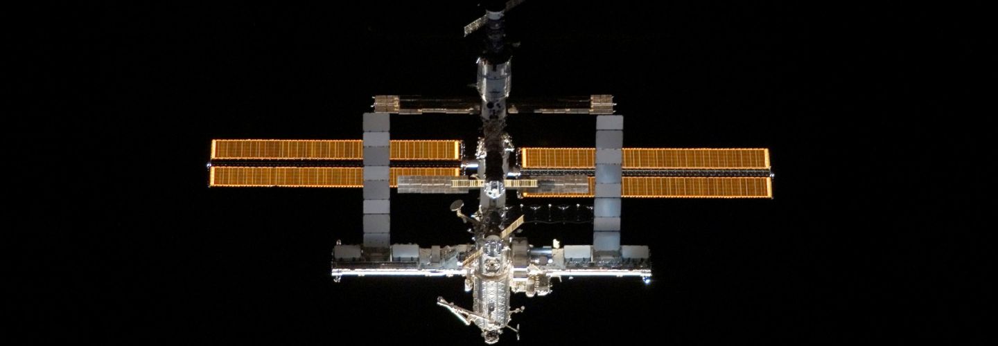 Stock image of the International Space Station on a solid black background.