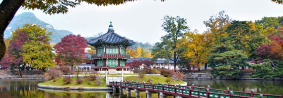 Gyeongbokgung Palace in the Middle of the Lake Surrounded with Autumn Trees