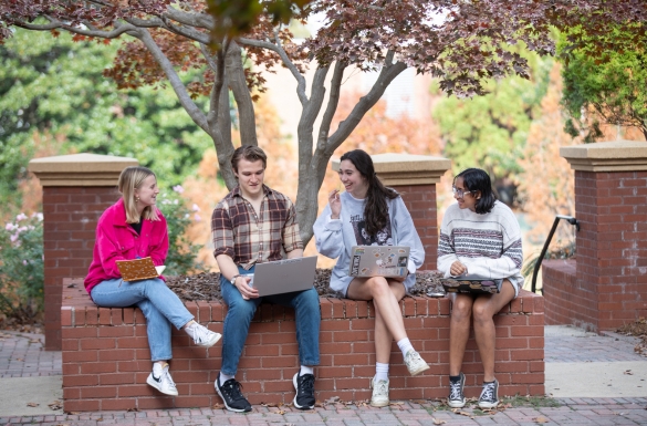 INTA students studying and laughing.